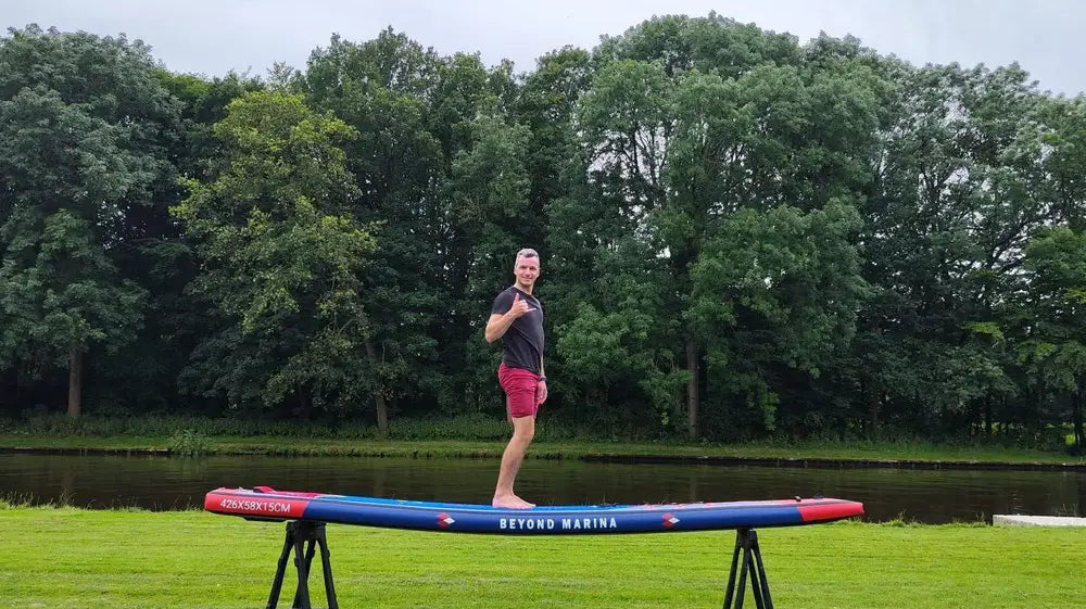 Inflatable paddleboard on sawhorses featured in Beyond Marina and Sun Media Brands review.