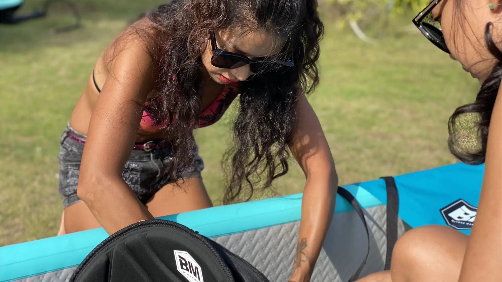 Inflatable paddleboard with accessories featuring drop stitch material and nose cone