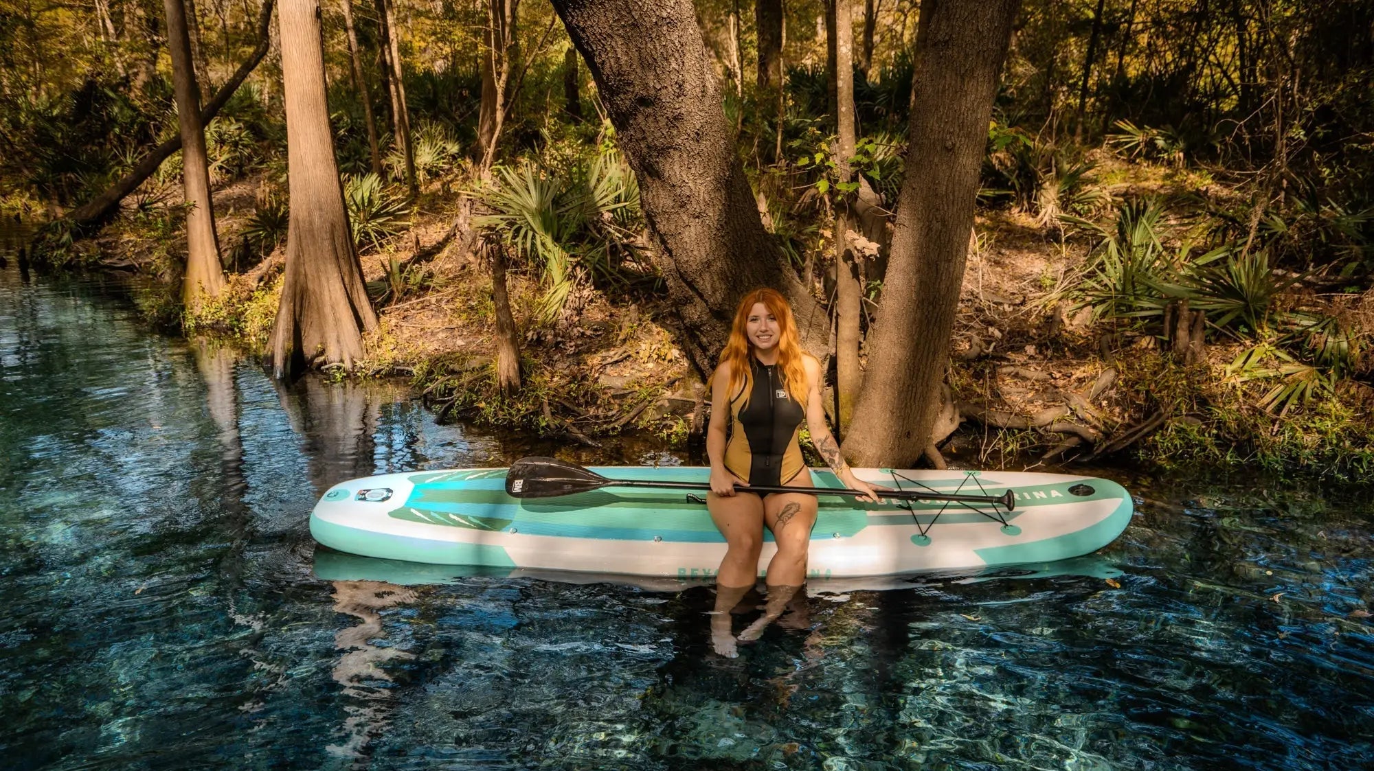 Paddleboard featuring drop stitch material and non-slip EVA surface for marina adventures