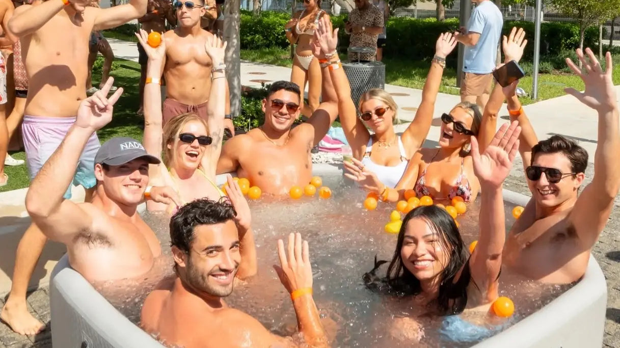People enjoying a marina inflatable octagonal ice bath tub for relaxation and recovery