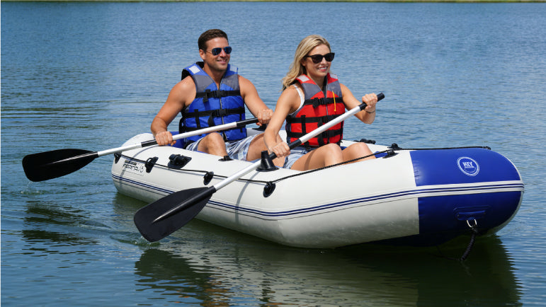 Two people in an inflatable fishing boat on a calm lake