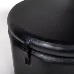 Black carbon-fiber topped container.