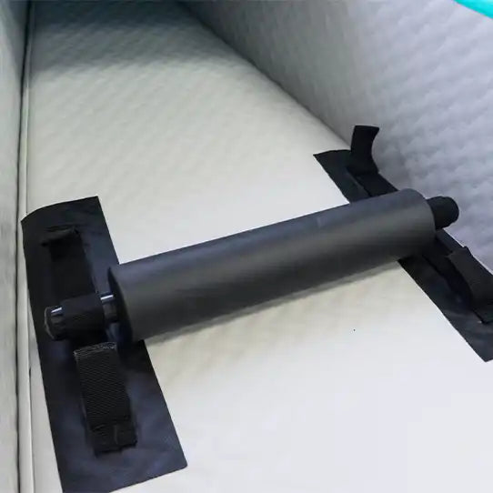 Black cylindrical handle with straps.