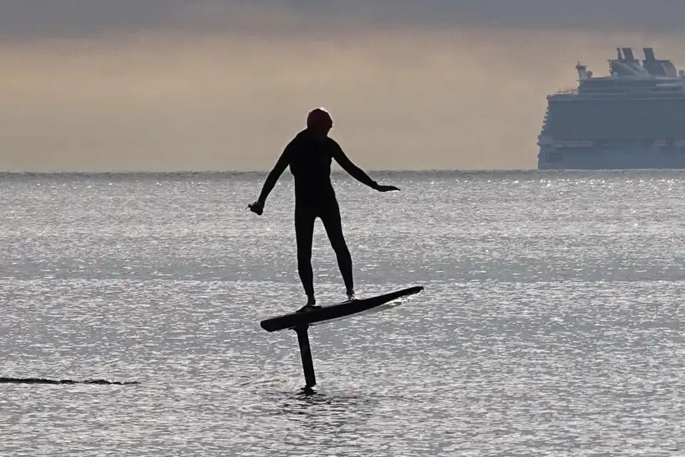 Hydrofoil surfer silhouette.