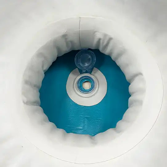 Inflatable blue and white pool with valve.