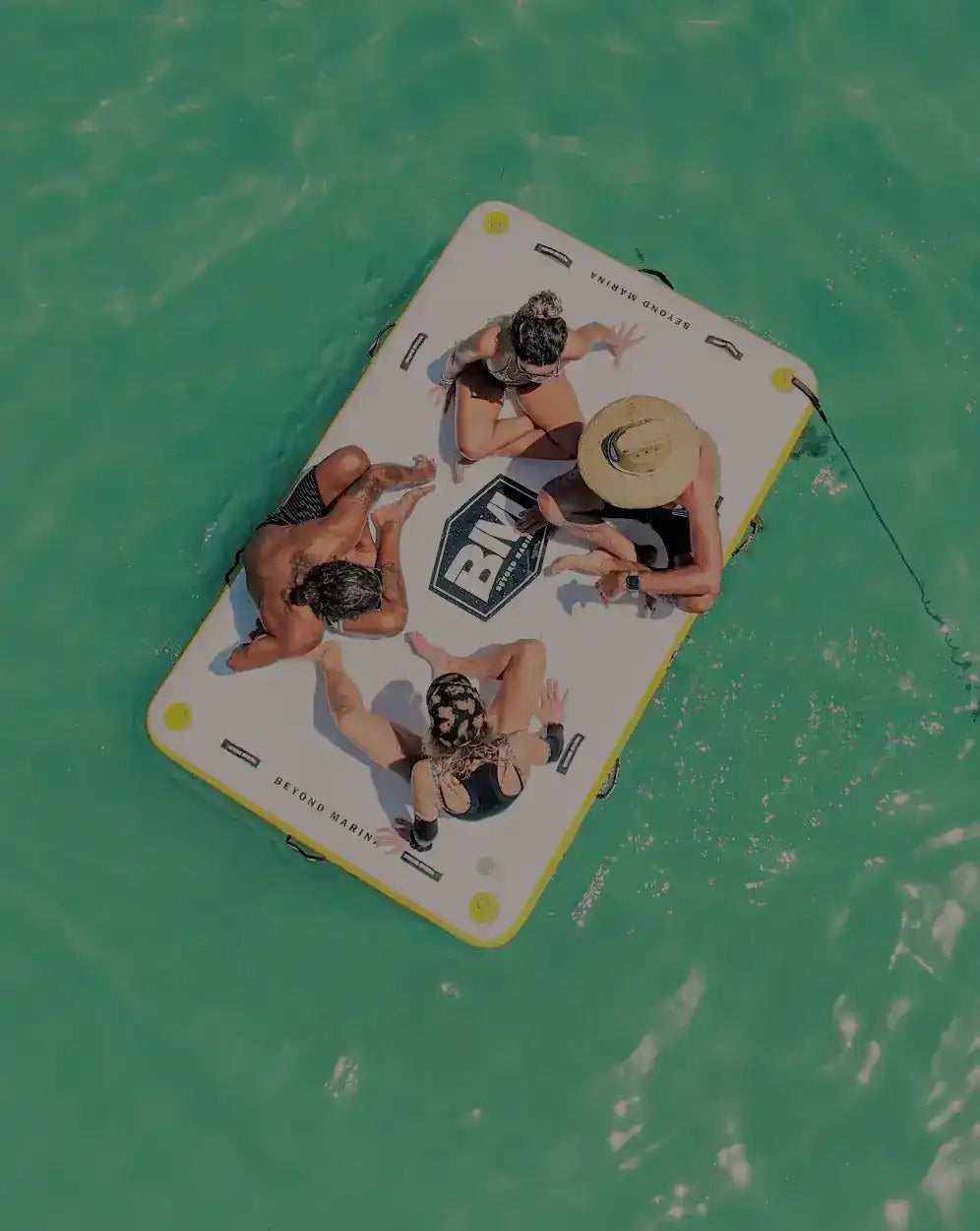 Inflatable floating platform with people.