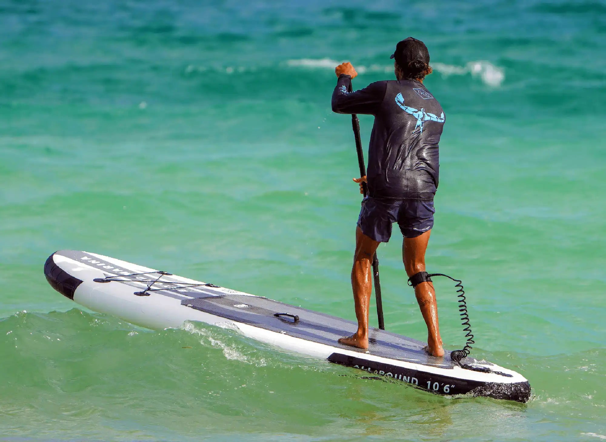 Paddleboarder with paddle.