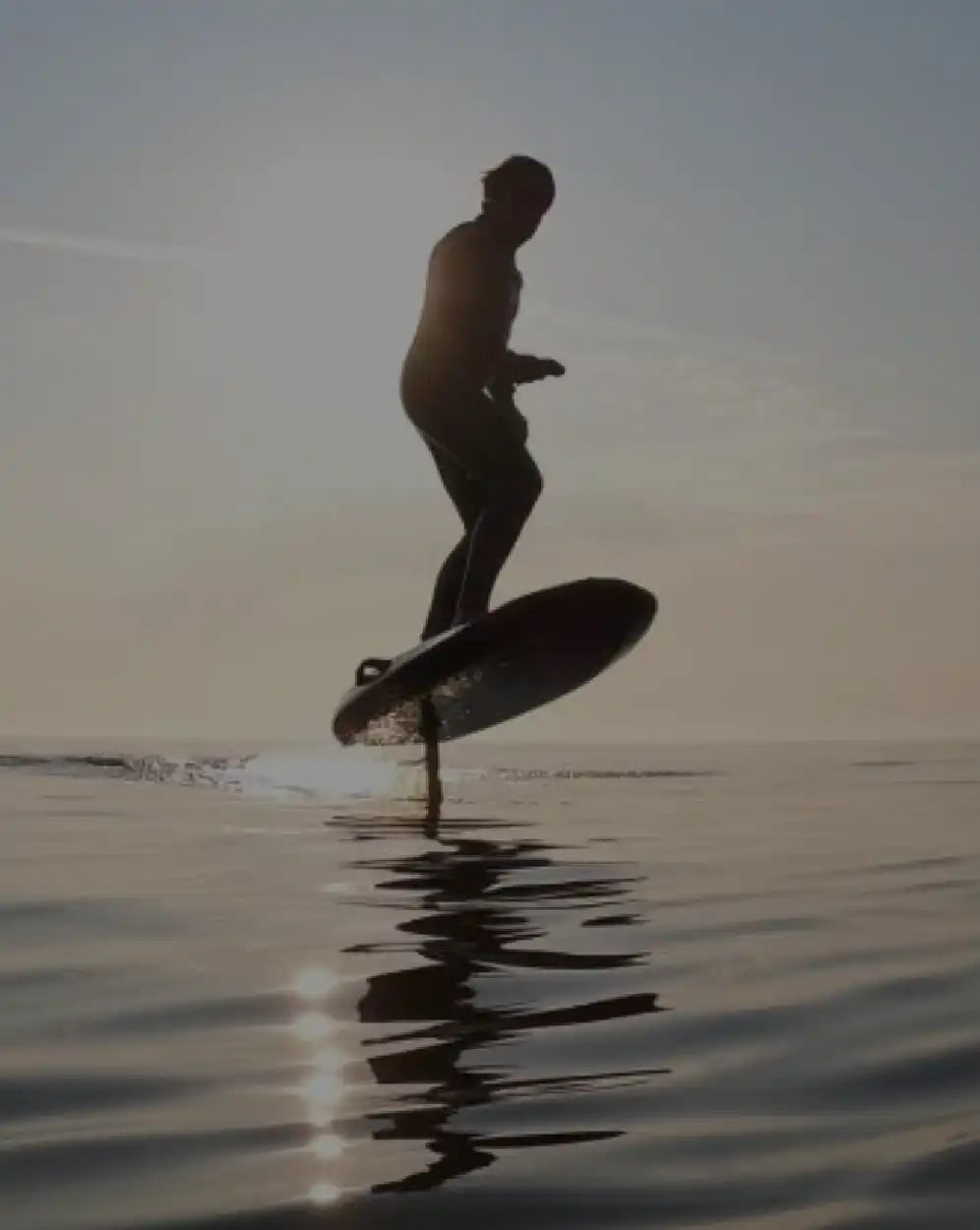 Person on hydrofoil surfboard.