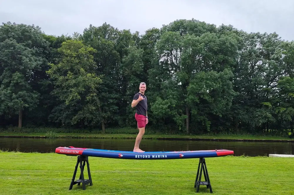 Inflatable paddleboard on sawhorses featured in Beyond Marina and Sun Media Brands review.