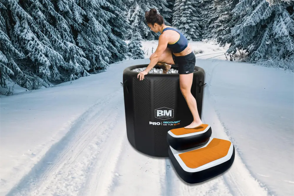 Black inflatable ice bath with orange-topped non-slip steps for cold plunge sessions