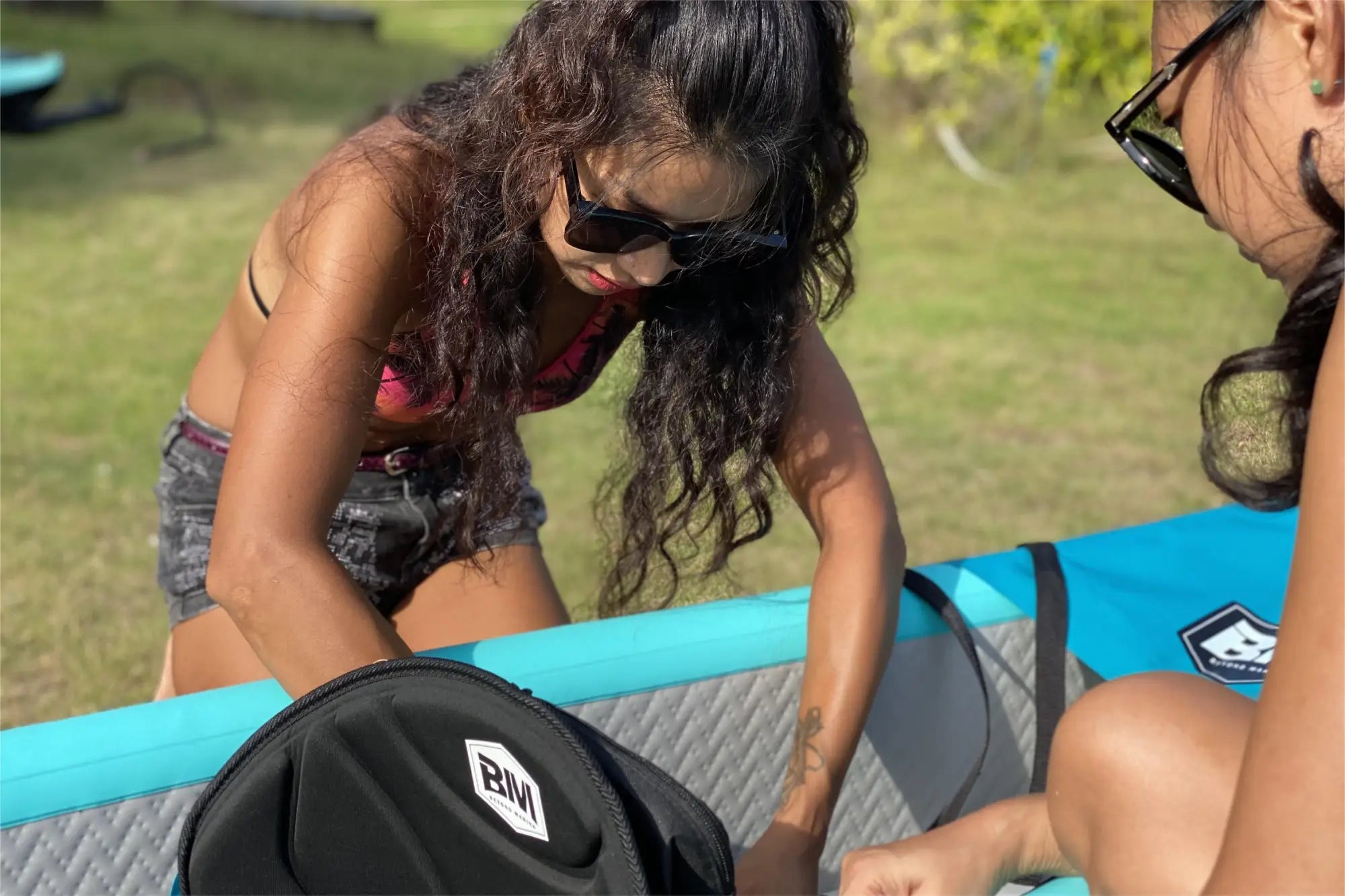 Inflatable paddleboard with accessories featuring drop stitch material and nose cone