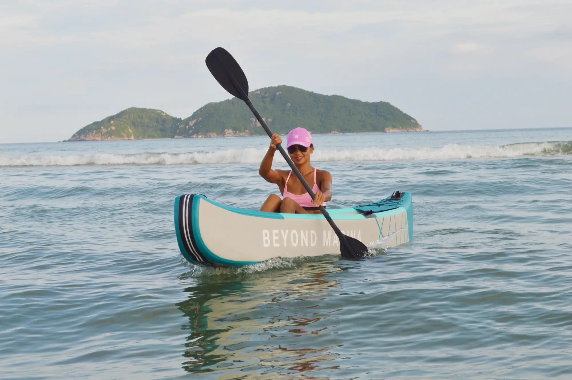 Inflatable kayak with paddle for water exploration using Beyond Marina Drop Stitch Kayak.