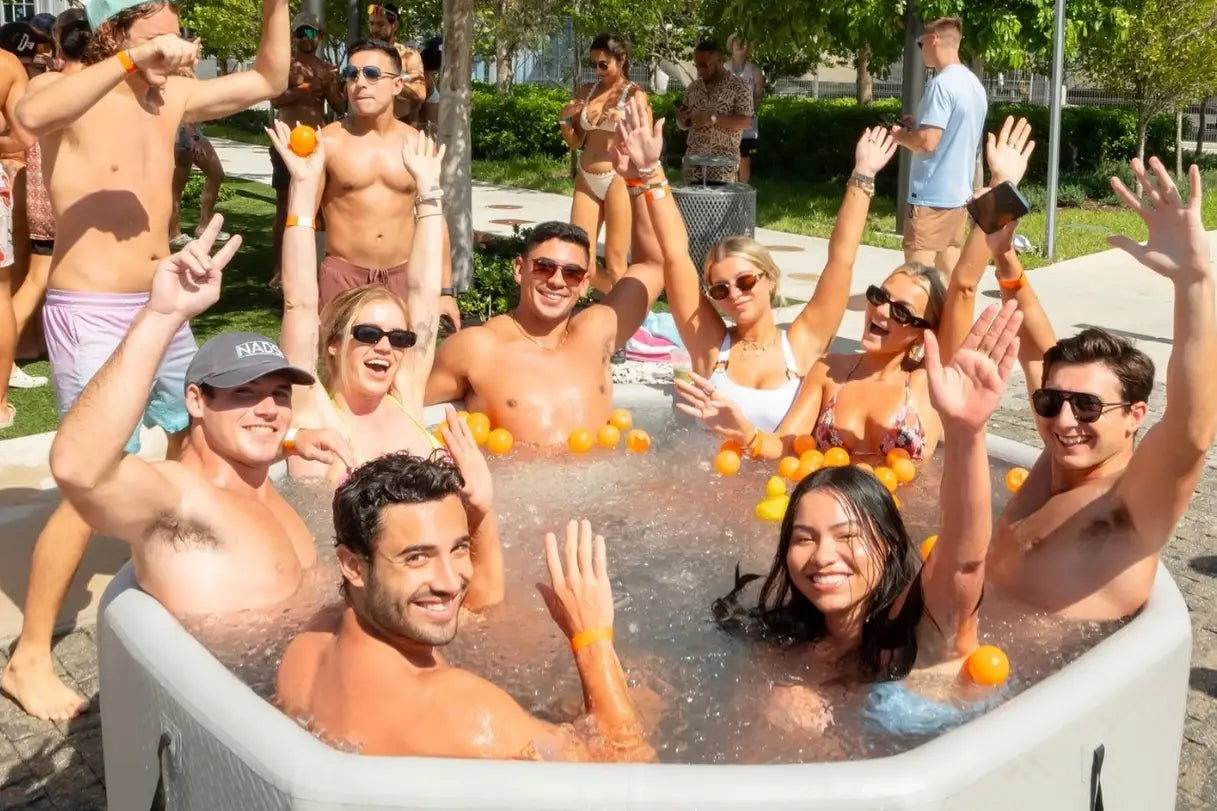 People enjoying a marina inflatable octagonal ice bath tub for relaxation and recovery