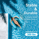 Woman relaxing on a blue inflatable pool float in a pool with palm trees.