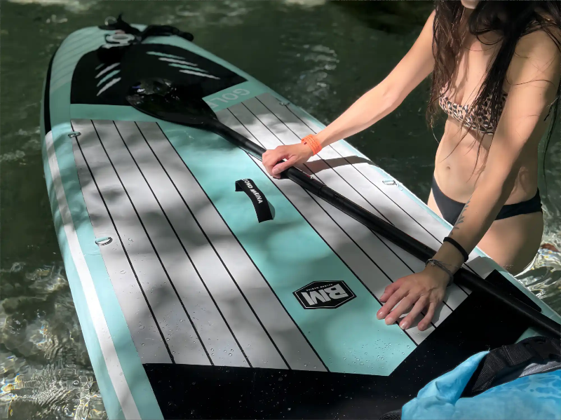 Aqua and white striped paddleboard.