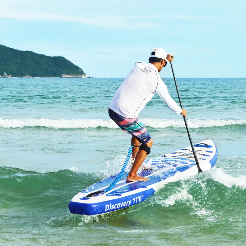 Man paddling on Beyond Marina’s featherlight™ inflatable paddle board.