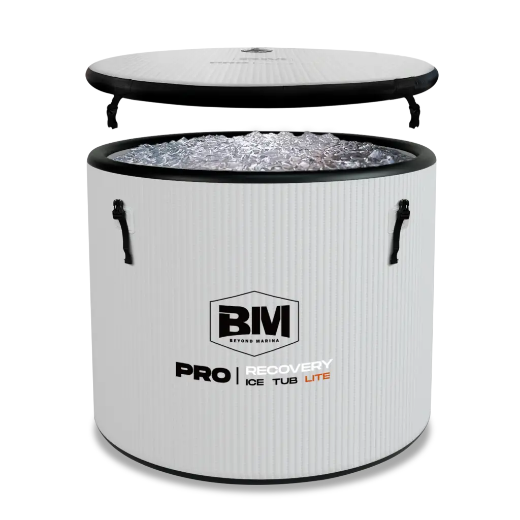 White portable cold plunge tub with handles and detached lid filled with ice for cold water therapy