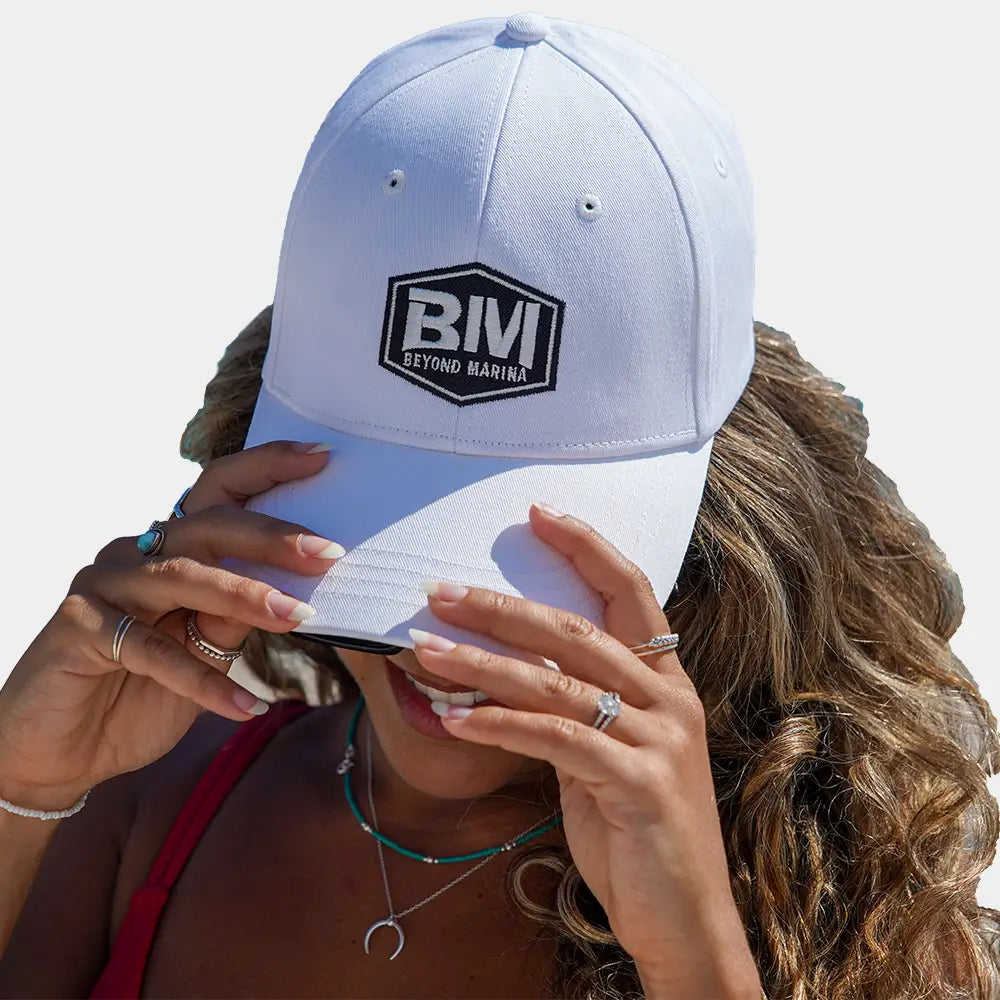 Custom Embroidered Shaka Hat - Woman wearing white hat with black logo