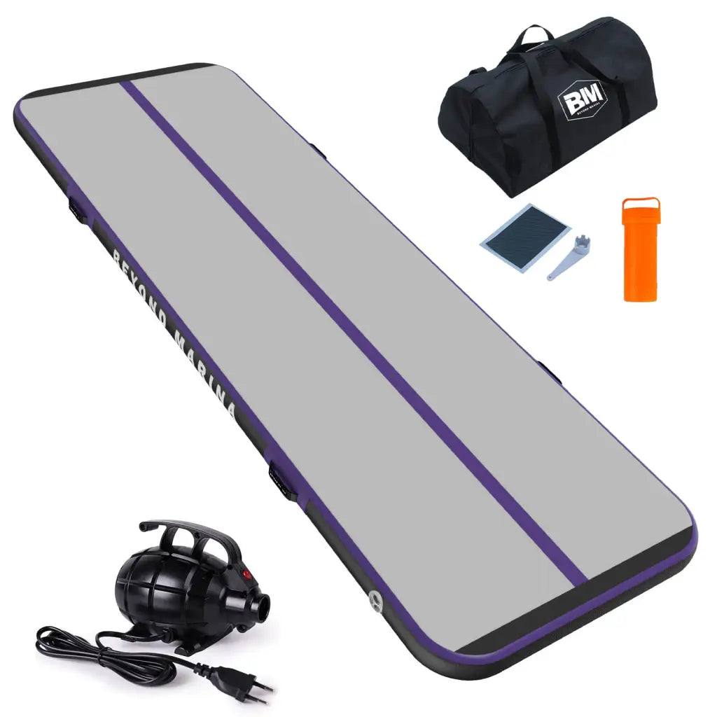 Skateboard with headphones and bag near Beyond Marina AIR TRACK INFLATABLE GYMNASTICS MAT TUMBLING TRACK - CARBON.