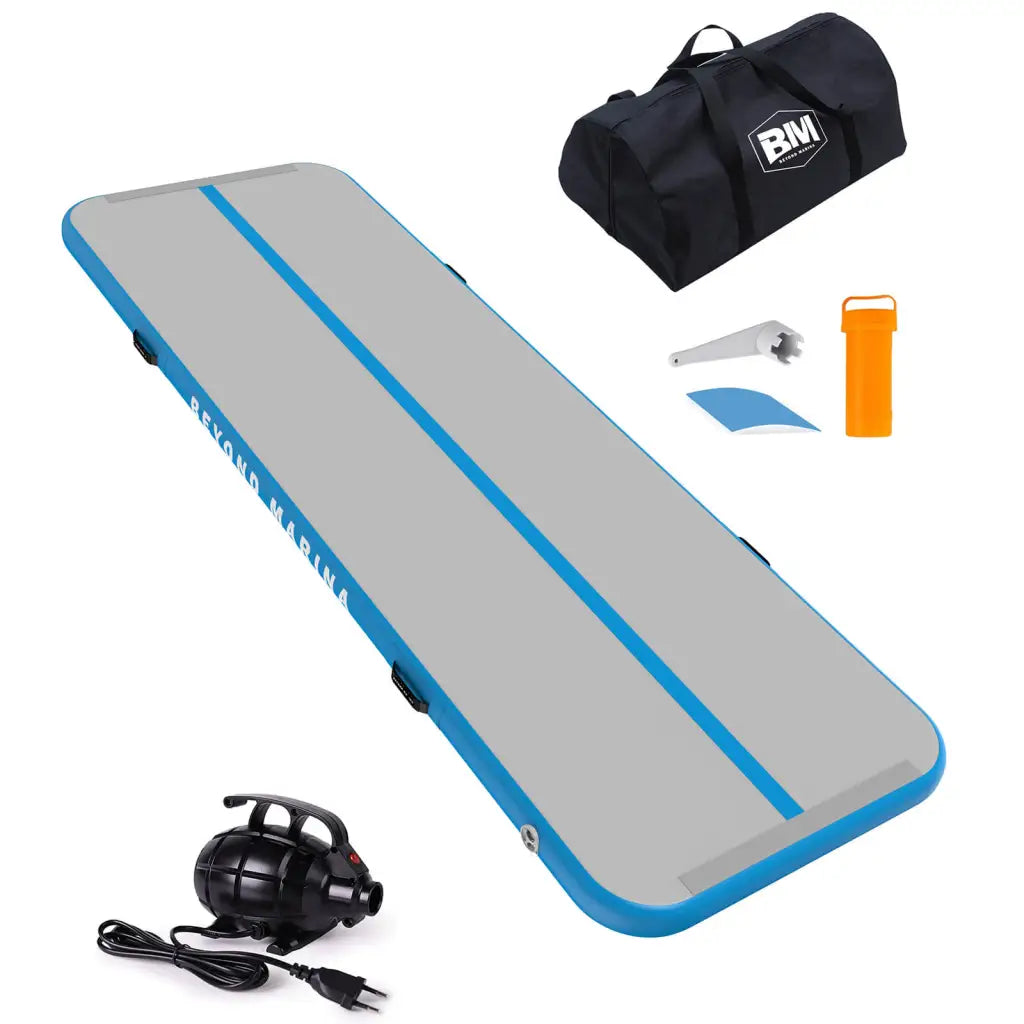 Blue and gray surfboard, bag, and headphones on Beyond Marina Air Track Inflatable Gymnastics Mat Tumbling Track - Pastel.