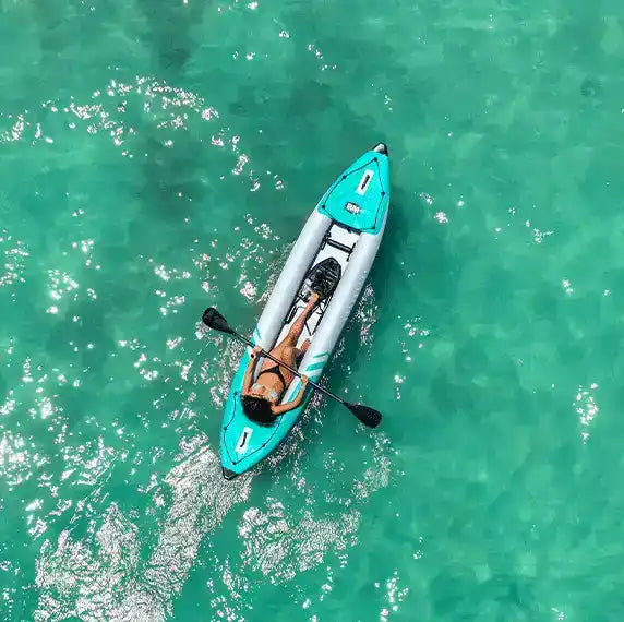 Inflatable kayak with a woman.