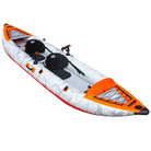Inflatable tandem kayak with rigid drop-stitch floor, orange camo pattern