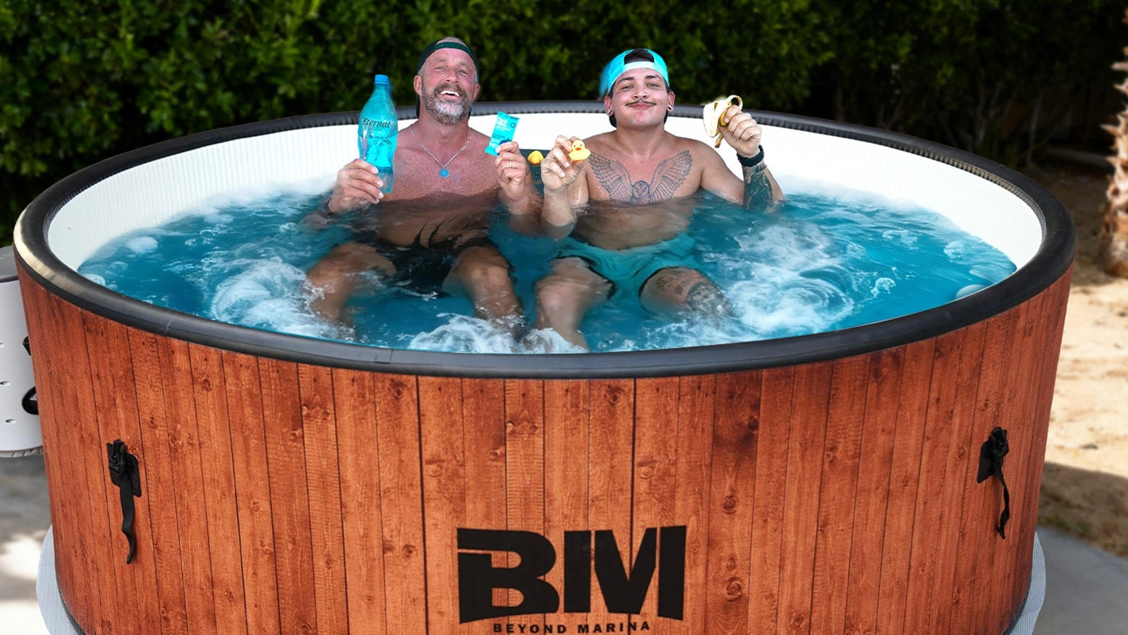 Two people relaxing in a portable hot tub.