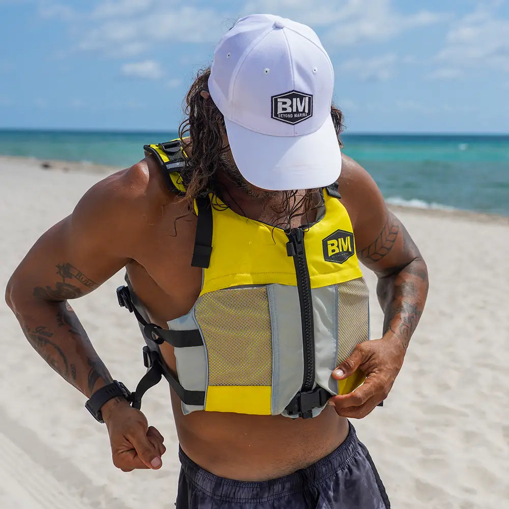 Man wearing BM Life Jacket with hat - essential water safety gear.